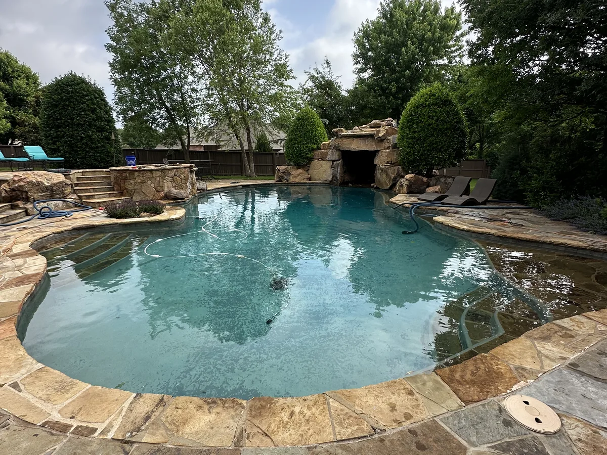 Freeform pool with boulder waterfall