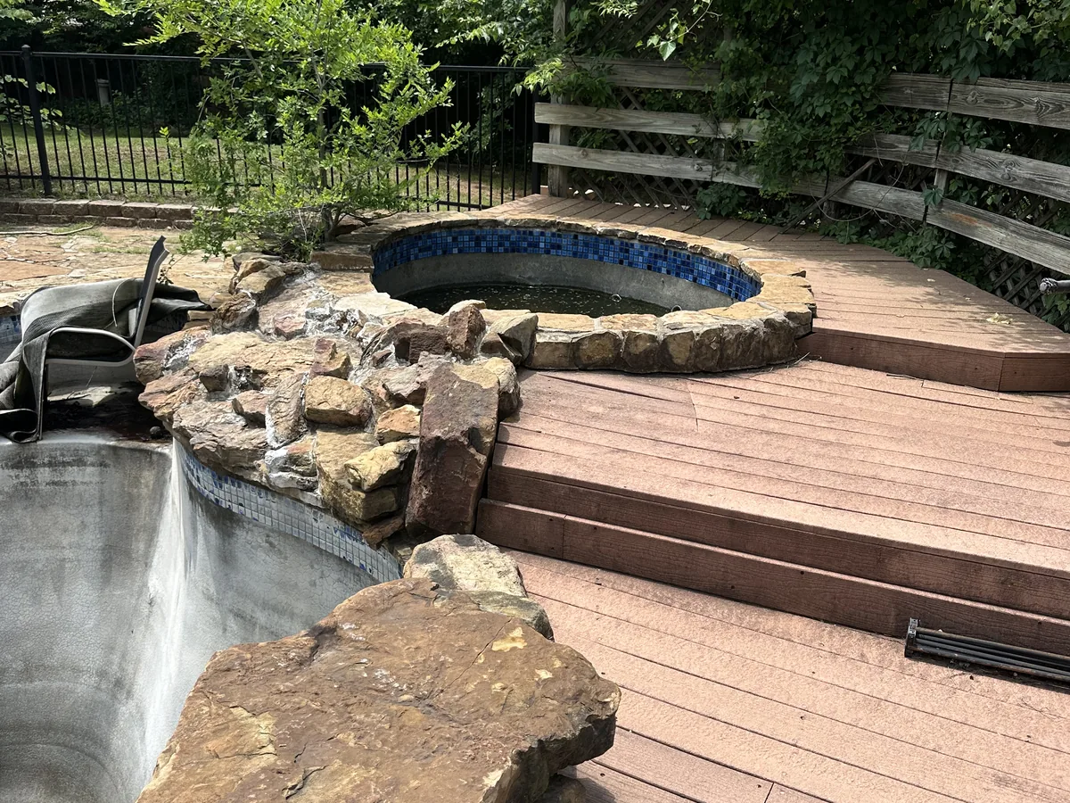 Freeform pool remodel with boulder water feature