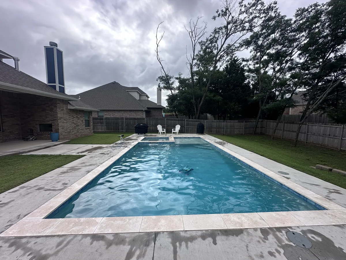 Geometric pool with step entry and coping