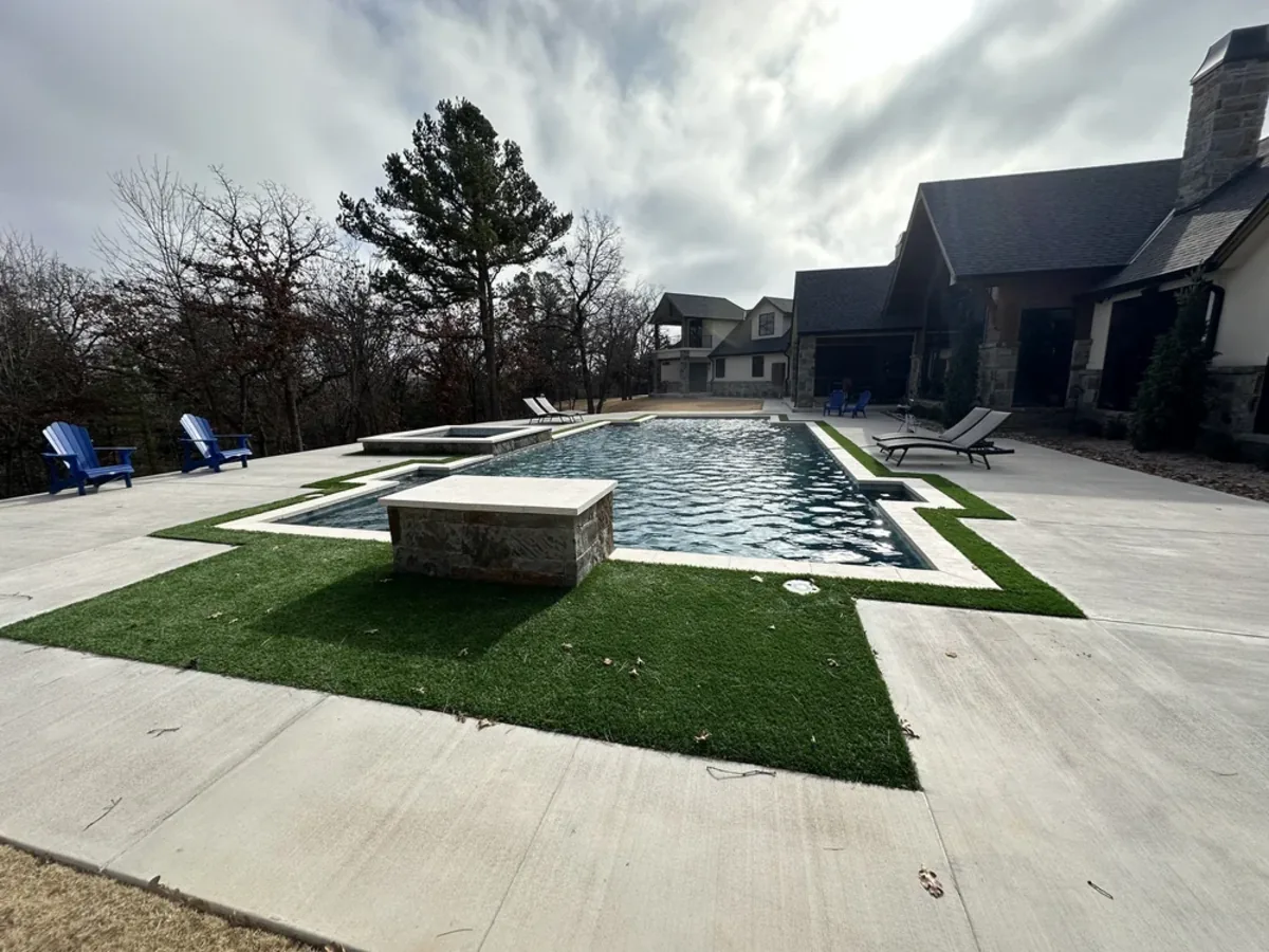 Geometric pool with raised stone fire feature