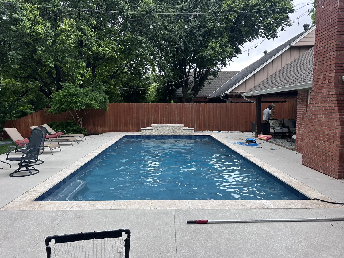 Rectangular pool with deck and lawn border