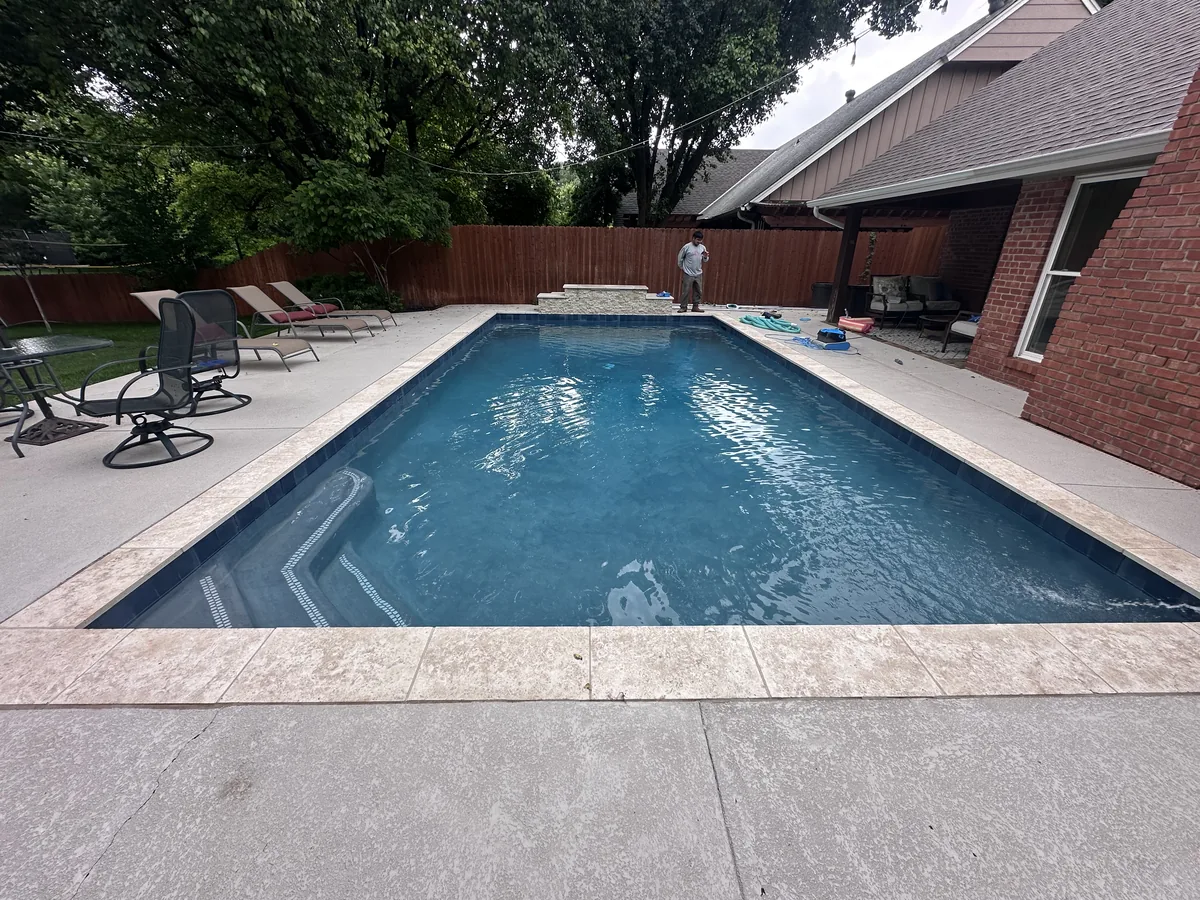 Rectangular pool with travertine decking